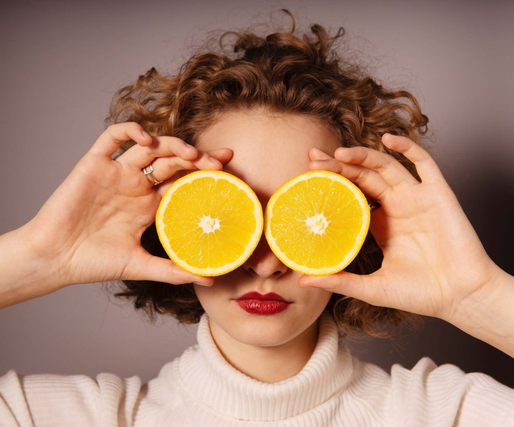 woman with oranges